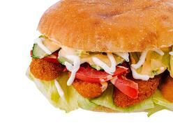 Delicious crispy chicken burger lying on white background photo