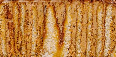 Delicious cake layers forming appetizing food background texture photo