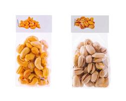 Cashew and pistachio nuts showing in transparent standing bags photo