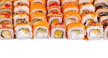 Large set of various sushi and rolls is lying on a white background photo