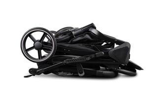 Modern folded black baby stroller isolated on white background photo