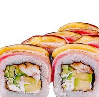 Delicious sushi rolls being served with eel, avocado, cream cheese, and mango photo
