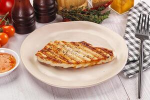 Grilled turkey fillet steak with sauce photo