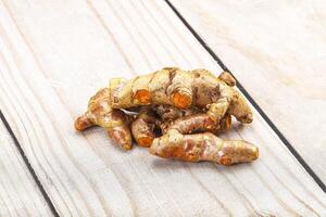 Fresh young Tumeric root heap photo