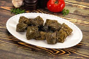 Stuffed dolma - meat in grape leaves photo