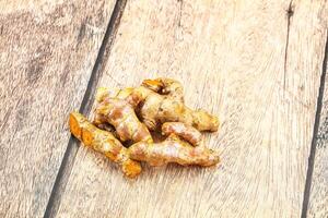 Fresh young Tumeric root heap photo