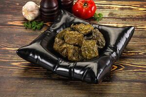 Stuffed dolma - meat in grape leaves photo