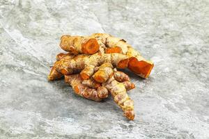 Fresh young Tumeric root heap photo