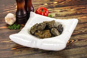 Stuffed dolma - meat in grape leaves photo