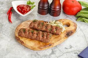 Kebab with beef served onion photo