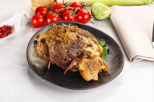 Baked Lamb shank with bone photo