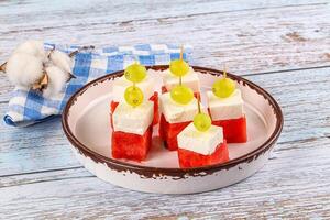 Watermelon with feta and grape photo