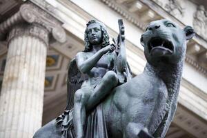 Bronze Statue of a Winged Figure and Lion at the Konzerthaus in Berlin photo
