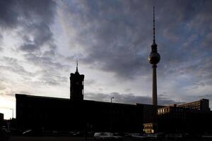 Berlins City Hall and TV Tower Silhouetted at Dusk photo