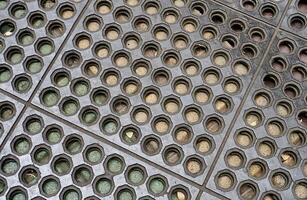 Anti slip rubber floor mat with round holes pattern isolated on horizontal ratio background. photo