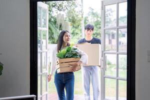 Couple Relocating to New Home with Enthusiastic Energy photo