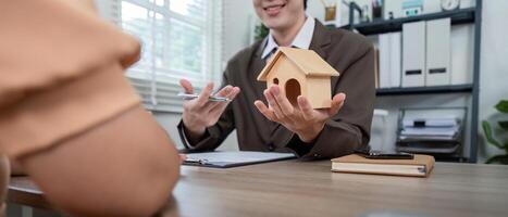 Real Estate Agent Illustrating Property Purchase Process to Client for Enhanced Buying Experience photo
