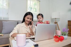 Multi tasking Mother Balances Remote Work and Childcare Using Tech Tools photo