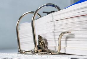 Close-up of a metallic of folder paper files with keeping various businesses concept object office automatic photo