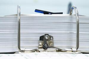 Close-up of a metallic of folder paper files with keeping various businesses concept object office automatic photo