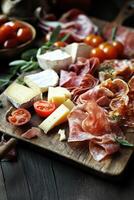 Artfully arranged charcuterie board with cheeses and cured meats photo
