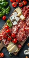 A culinary board with tomatoes, cheese, and cured meats at a rustic kitchen photo