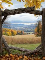 Autumn landscape framed by rustic wooden fence showcasing colorful foliage photo