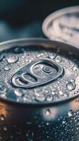 Close-up of beverage cans covered in droplets in ambient light photo