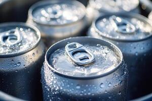 Refreshing cold cans of soda nestled in ice during a summer gathering photo