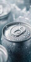 Refreshing beverage cans with droplets in a chilled setting photo