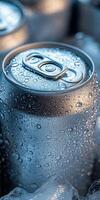 Cold beverage cans resting on ice captured in soft light photo
