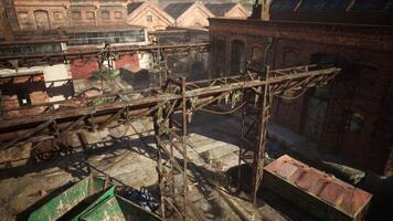 Abandoned factory with collapsing brick structures and rusted machinery video