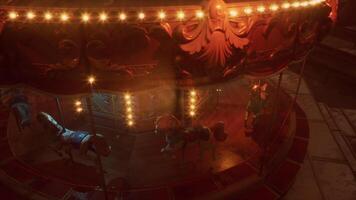 Empty amusement park at night featuring an illuminated carousel and stillness video