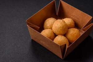 Fast food cheese balls breaded with salt and spices photo