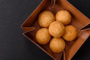 Fast food cheese balls breaded with salt and spices photo