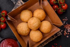Fast food cheese balls breaded with salt and spices photo