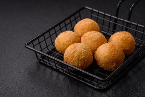 Fast food cheese balls breaded with salt and spices photo