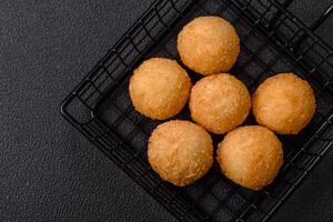 Fast food cheese balls breaded with salt and spices photo