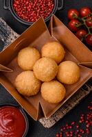 Fast food cheese balls breaded with salt and spices photo