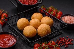 Fast food cheese balls breaded with salt and spices photo