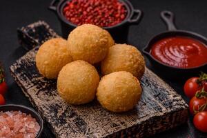 Fast food cheese balls breaded with salt and spices photo