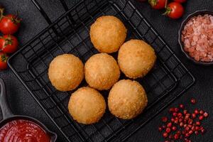 Fast food cheese balls breaded with salt and spices photo