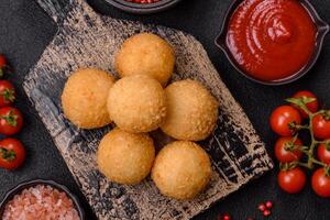 Fast food cheese balls breaded with salt and spices photo