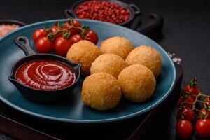Fast food cheese balls breaded with salt and spices photo