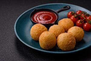Fast food cheese balls breaded with salt and spices photo