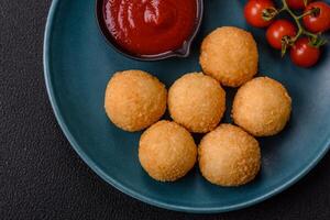 Fast food cheese balls breaded with salt and spices photo
