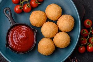 Fast food cheese balls breaded with salt and spices photo