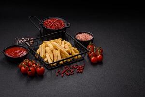 Fast food french fries with salt and spices photo