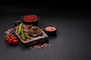 Juicy beef or pork cut into slices with boiled asparagus photo