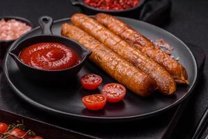 Juicy fried beef or pork sausages with salt, spices and herbs photo